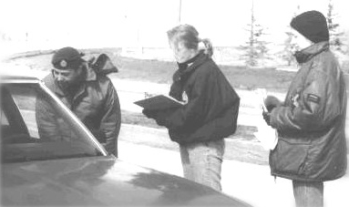 A picture of staff checking cars of people returning home. City of Winnipeg Photo