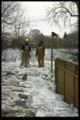 Scotia Street - City personnel removing dike, City of Winnipeg Photo.