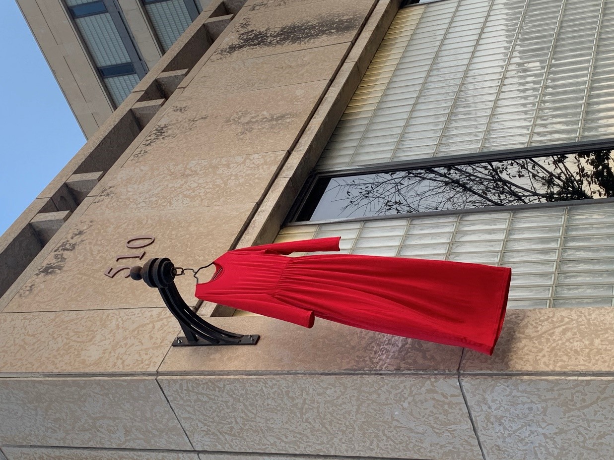 MMIWG2S+ Red dress hanging at city hall building