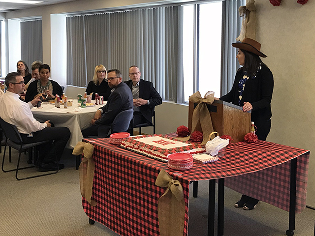Amy Samphir thanks guest trainers during a western-themed appreciation lunch.