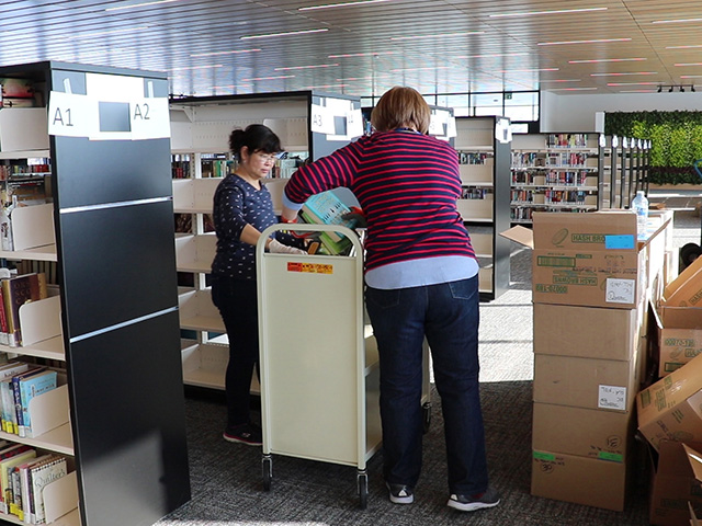 Around 20 employees helped pack and unpack roughly 40,000 books.