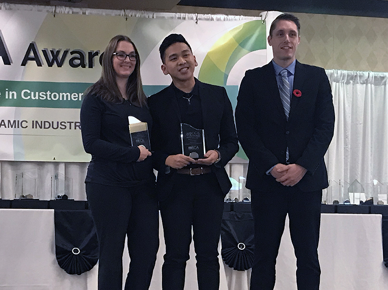 Monica Noakes (left) and Lawrence Castro (centre) from the Water and Waste Department’s Utility Billing Centre receive their awards.