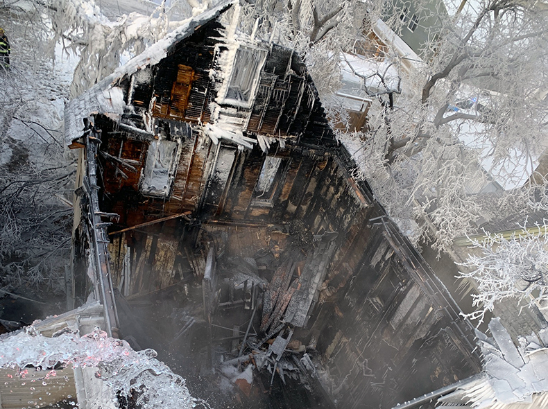 arial view of a burnt down, vacant apartment building