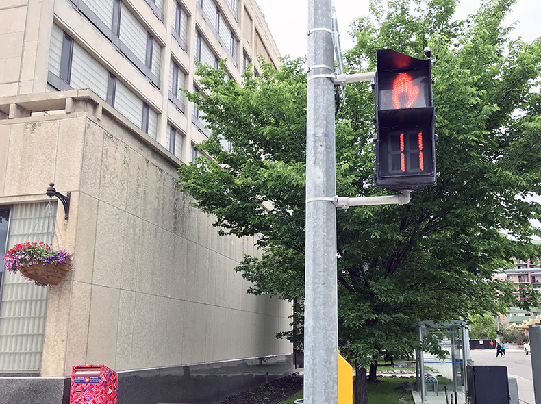 A countdown signal in front of City Hall on Main Street.