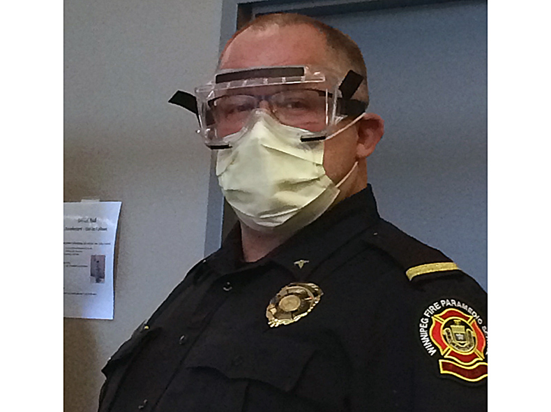 A Paramedic Training Officer with a mask and safety glasses