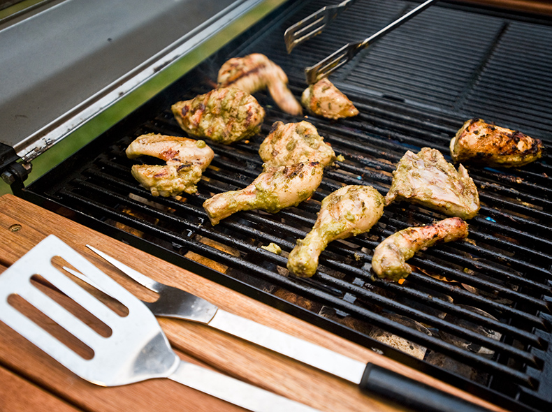 Chicken cooking on a grill