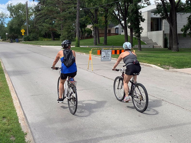 two people riding bikes