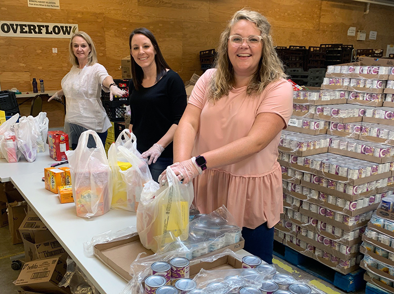 City of Winnipeg employees providing assistance at local food bank
