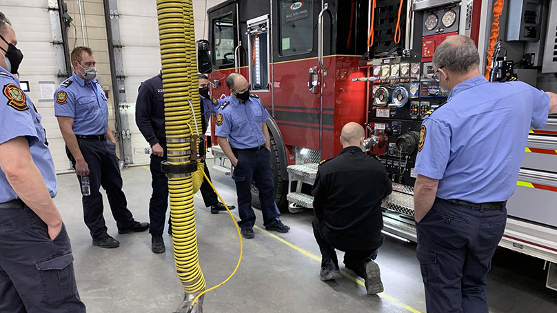 Brad Enders, Director of WFPS’ Emergency Mechanical Services Branch, goes over features of the new engines with crews