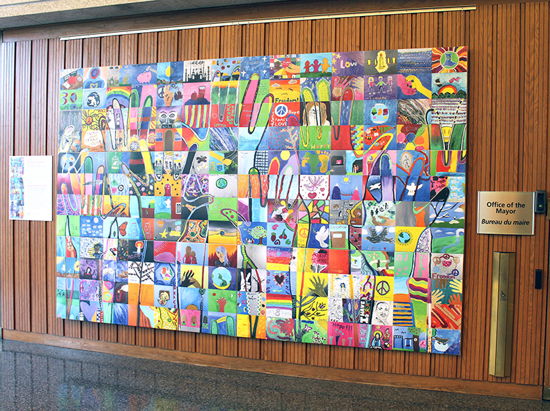 Human rights mural created by students now on display at City Hall