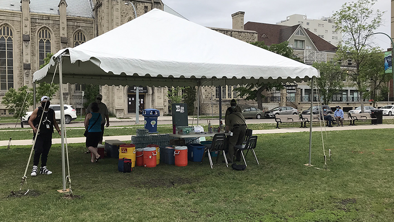 Downtown Community Safety Partnership, temporarily set up a tent in Central Park to provide bottles of water and a shaded location for individuals looking for a break from the heat 
