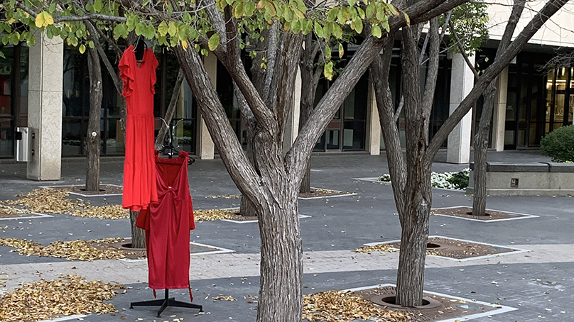 The red dresses hung around City Hall on October 4, 2021.