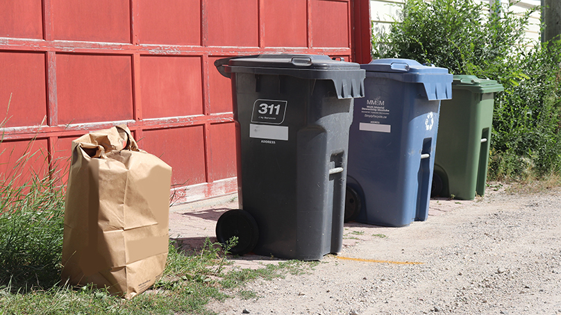 Garbage bins and recycle bins at the backlane, garage curbside.