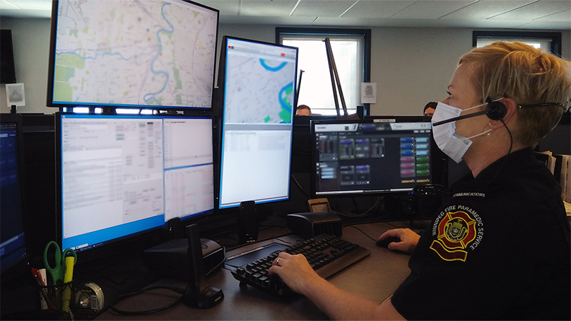 A WFPS 911 call-taker working with the new computer-aided dispatch system.