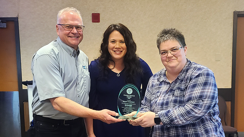 Sharon Arsenault (right) receives the Prairie Crocus Award from Manitoba Recreation.