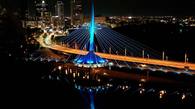 The new lighting system on Esplanade Riel can be programmed to illuminate the bridge in any colour.Photo credit: Field Service Canada