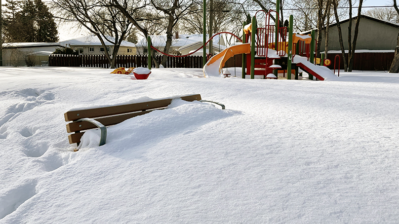 High snow piles on residential playground