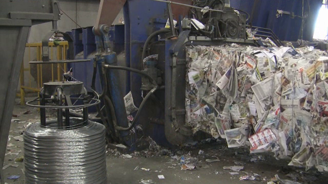 Paper being baled at the Materials Recovery Facility