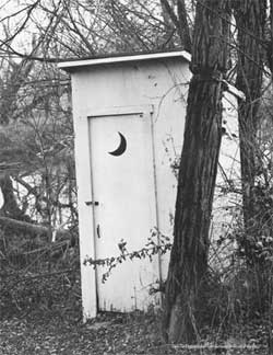 Public Outhouse located along side the Little Miami River near Waynesville, Ohio. From the Vanishing American Outhouse by Ronald S. Barlow.